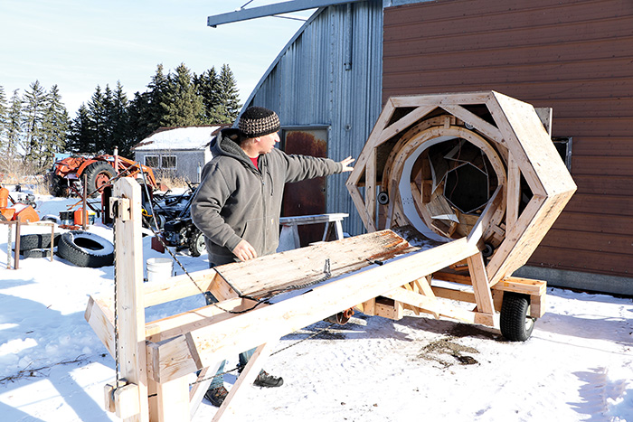 Aaron Hack built his own tree baler to help with the wrapping and shipment of Christmas trees that he grows at Cornucopia Tree Nurseries, to help make it easier for families to bring back to their homes.